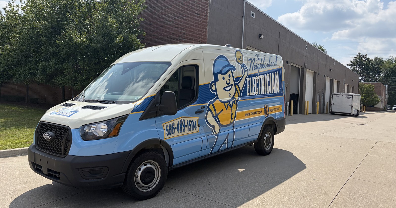 The Neighborhood Electrician service van, marked and stocked, parked outside a Metro Detroit home